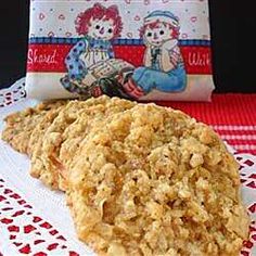 an oatmeal cookie sitting on top of a red and white table cloth