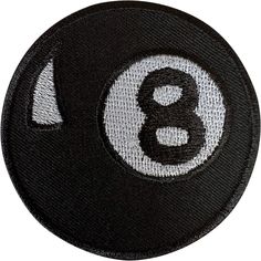 a black and white patch with the number eight on it