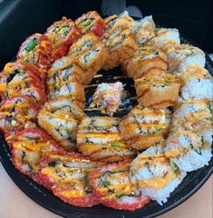 sushi rolls are arranged on a plate in the back seat of a car, ready to be eaten