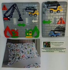 there are three magnets on the wall with construction trucks and cars painted on them