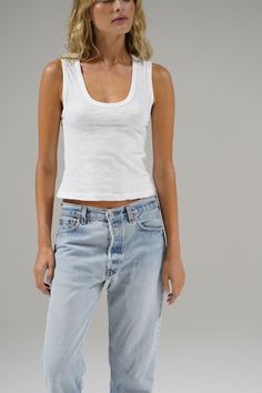 A deep u neckline with bra friendly straps make this tank ultra flattering. Meant to hit top of pant, depending on the rise, this tank gives the most classic vibe. Model is 5'9" and wearing a size small Cotton Slub Fabric: 100% Cotton Recommended Care: Machine wash cold and lay flat to dry Made in the USA