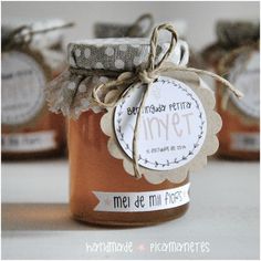 three jars of honey with labels on them