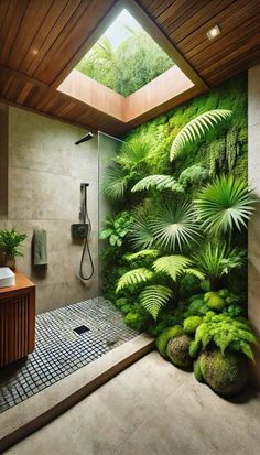 a bathroom with plants on the wall and a skylight in the shower area is shown