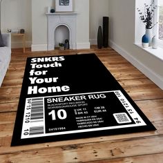 a black and white area rug with some barcodes on it in a living room