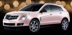 a pink cadillac suv parked in front of a black background with boket lights