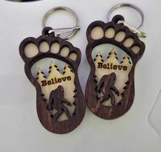 This unique Bigfoot keychain is laser cut from two layers of birch wood and finished with a walnut stain and natural accents. It measures approximately 3 x 1.5 including the key ring, and ships within 5 to 7 days. Show your belief in Bigfoot with this quality and stylish keychain. Things To Make With Laser Engraver, Wood Keychain Ideas, Keychain Ideas, 3d Ideas, Wood Keychain, Ideas Handmade, 5 To 7, 3d Laser, Dream Design