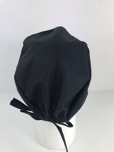 Simple, streamlined, and comfortable Skull Cap design! This classic style accommodates short to medium length of hair. Made out of 100% cotton. Cap size is standard. Cap has an elastic on the back for size adjustment Foldable trim allows for depth adjustment. Black Casual Bonnet With Adjustable Fit, Cotton Bonnet Cap, Black Cotton Hat, One Size Fits Most, Black Cotton Hat One Size, Black Cotton Hat One Size Fits Most, Fitted Solid Cotton Hats, Fitted Cotton Hats In Solid Color, Fitted Cotton Hat In Solid Color, Fitted Solid Color Cotton Hats