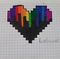 a heart made out of colored crayons on graph paper