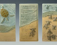 three metal plaques with sea turtles on them and words written in the bottom left corner