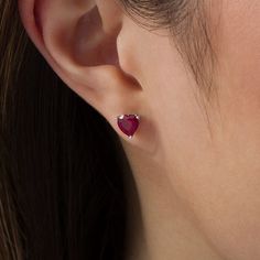 Perfectly petite, these heart stud earrings are a charming look she’ll want to wear day after day. Crafted in sterling silver, each adorable earring showcases a 6.0mm heart-shaped lab-created bright red ruby solitaire atop a sculpted scrollwork setting with heart-shaped details. Buffed to a brilliant luster, these post earrings secure comfortably with friction backs. Peoples Jewellers, Heart Stud Earrings, Heart Studs, Red Ruby, Heart Earrings Studs, Sterling Silver Earrings Studs, Cute Earrings, Heart Earrings, Bright Red