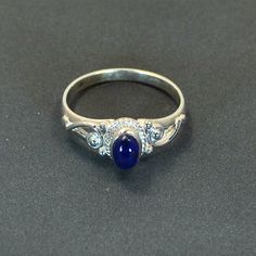 Classical style ring in sterling silver with lapis lazuli setting, available in the following finger sizes: UK sizes K, L, N, O, Q.   U.S. sizes 5 ½, 6, 7, 7 ½, 8½. DO NOT FORGET TO SEND YOUR FINGER SIZE WITH ORDER. Technical details: this is a very fine ring for customers who prefer discreet jewellery in classical style.  The size of the stone is 6x4mm/0,24x0,16inch, the width of the shank is 2mm/ 0,08inch and the width of the ring silver + stone is 7,5mm/0,3inch. Other stones available in the Classic Blue Lapis Lazuli Rings, Classic Lapis Lazuli Ring With Polished Finish, Classic Silver Sapphire Cabochon Ring, Classic Silver Sapphire Ring With Cabochon, Classic Silver Sapphire Ring With Oval Cabochon, Blue Lapis Lazuli Cabochon Rings, Elegant Blue Moonstone Ring Stamped 925, Silver Cabochon Sapphire Rings, Silver Sapphire Ring With Cabochon