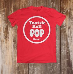 a red t - shirt with the words tootsie roll pop on it