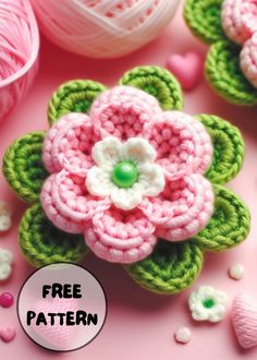 crocheted flowers and balls of yarn on pink background with free pattern for the flower