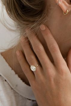 a close up of a person wearing a ring