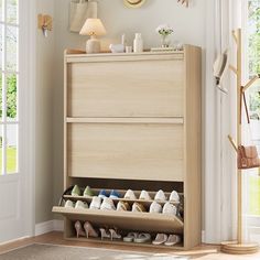 a wooden shoe rack with several pairs of shoes on it in front of a door