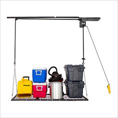 an overhead storage rack with various containers and equipment hanging from it's sides on a white background