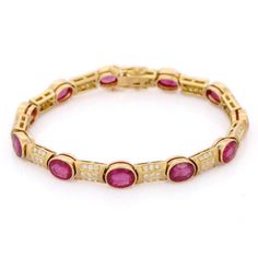 This is part of Chairish’s Fine Jewelry assortment.  Ruby and Diamond bracelet in 18K Gold. It has a perfect oval cut gemstone to make you stand out on any occasion or an event. A tennis bracelet is an essential piece of jewelry when it comes to your wedding day. The sleek and elegant style complements the attire beautifully, whether it's the bride wearing it herself, or as a gift to her bridesmaids to wear on the D’day.  Bracelets are worn to enhance the look. Women love to look good. It is com Luxury Oval Diamond Bracelet With Gemstone, Classic Oval Gemstone Tennis Bracelet, Formal Oval Gemstone Tennis Bracelet, Formal Oval Gold Bracelet With Gemstones, Oval Gold Gemstone Bracelet For Formal Occasions, Oval Gold Bracelet With Gemstone For Formal Occasions, Formal Oval Gold Gemstone Bracelet, Luxury Oval Tennis Bracelet As Gift, Luxury Oval Gold Bracelet For Wedding