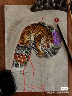 a drawing of a tiger laying on top of a piece of paper