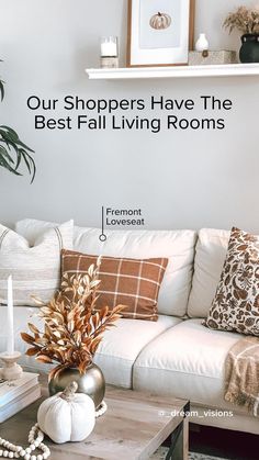 a living room with white couches and pillows on top of the couch is featured in this article