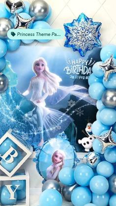 a frozen princess birthday party with balloons and decorations