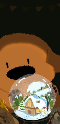 a brown teddy bear sitting next to a snow globe