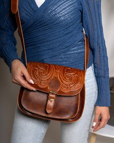 Boho crossbody leather bag, Honey brown pyrography saddle purse, leather shoulder purse, Greek handmade leather tooled bag , manufactured by the best cowleather from our Greek island Crete. This crossbody bag has two different spaces inside big enough for your every day essentials, books, tablet or maybe your mobile. A smaller zipper inside secures a third space which you can put your money or your keys. Inspired by Ancient Greece gives you a unique style that everybody will love. All of our pro Artisan Hand Tooled Crossbody Saddle Bag, Hand Tooled Crossbody Satchel, Hand Tooled Satchel Saddle Bag For Travel, Hand Tooled Saddle Bag Satchel For Travel, Hand-tooled Rectangular Saddle Bag, Hand Tooled Saddle Bag Satchel For Daily Use, Hand Tooled Leather Crossbody Saddle Bag, Hand Tooled Saddle Bag For Daily Use, Artisan Crossbody Saddle Bag