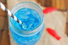 a blue drink with a toothbrush in it