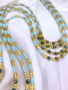 Single Strand Waist Bead Senoufo harmonizes the beauty of light blue crystal glass seed beads with the timeless elegance of gold glass seed beads. This handcrafted masterpiece captures the essence of sophistication, inviting you to adorn yourself with grace and style. 🌊 Light Blue Crystal Glass Seed Beads: Reflecting the tranquil hues of the sky and sea, the light blue beads exude calm and serenity. Blue signifies wisdom and clarity, empowering you with a sense of purpose. 🌟 Gold Glass Seed Be Strong Hand, Natural Glow, Gold Glass, Blue Crystals, Blue Beads, Gold Beads, Essence, Design Crafts, Timeless Elegance