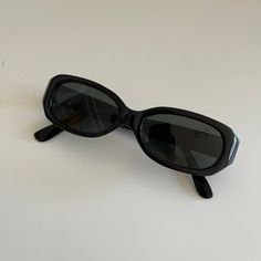 Authentic rectangle sunglasses featuring a black frame with smoke tint lens. True genuine vintage sunglasses from the 90s. This style is unisex. - 400 uv  Measurements: Lens height: 29mm Lens width: 50mm Bridge: 15mm Arm temple: 140mm Frame width: 137mm - new vintage from the 90s - includes sunglasses pouch Cool Black Sunglasses, Retro Black Sunglasses, Sunglasses 90s Vintage, Black Vintage Sunglasses, Black Rectangle Sunglasses, Vintage Black Sunglasses With Tinted Lenses, Vintage Black Rectangular Sunglasses, Vintage Rectangular Glass Sunglasses, 90s Sunglasses