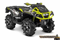 a yellow and black four - wheeler on a gray background