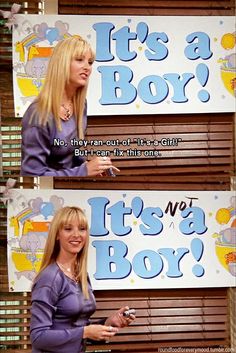 a woman holding a cell phone in front of two billboards that say it's a boy and it's not a boy