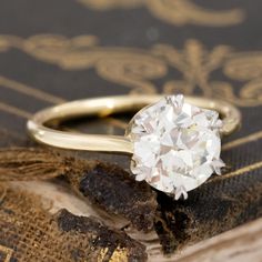 A stunner of a ring on the finger! Its everything we love with antique diamonds and vintage solitaires - charming yet subtle style, allowing the old European cut diamond center to do all the talking (and sparkling!). Will stack perfectly with a wedding date as well. Platinum gallery with an 18kt yellow gold shank Size 5.5, and fully sizable Diamond measures 7.55 - 7.71 x 4.76 mm GIA link here Timeless Classic Cut Diamond Ring With Single Cut Diamonds, Timeless Diamond Ring With Single Cut, Timeless Diamond Ring With Single Cut Diamonds, Timeless Round Rose Cut Diamond Wedding Ring, Timeless Round Wedding Ring With Rose Cut Diamonds, Timeless Wedding Ring With Rose Cut Diamonds, Timeless Rose Cut Diamond Wedding Ring, Classic Rose Cut Diamond Wedding Jewelry, Heirloom Diamond White Jewelry In Classic Cut