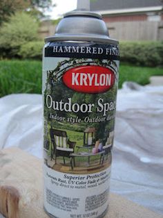 a can of krylon outdoor spray sitting on top of a piece of wood