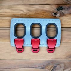 three pairs of red and blue luggage hooks