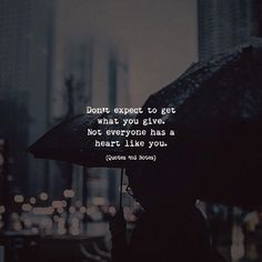 a person holding an umbrella in the rain with a quote on it that says, don't expect to get what you give not everyone has a heart like you