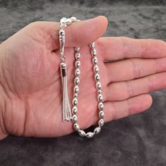 Including the Silver Cord. General: 33 pcs Ø5x7.5 mm barley cut beads Weight: 18 grams Length: 21.5  cm including tassel Material:  925 sterling silver. See our other models here: http://www.etsy.com/shop/Tesbih?ref=si_shop   Hand-made. Do not compare it to products sold in the shops. Each one makes the master. Tried using the most robust rope. Disperse a day in two days. Remain intact for many years. Does not Tarnish metals were used. The unique design is unique. Islamic Prayer, Don't Compare, Prayer Beads, Pure Silver, Rosary, Bead Charms, Bathing Beauties, Unique Designs, Charms