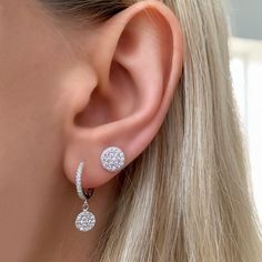 Add a drop of sparkle to every outfit with Alexandra’s huggie hoop earrings, featuring a dainty disc charm adorned with pave’ cz stones. Sparkle from day to night in these modern classic hoop earrings. Details: • Round Brilliant Cubic Zirconia Stones• 18kt Yellow Gold Plated or Rhodium Plated Sterling Silver • Disc: 6mm • Length: 12mm Luxury Dazzling Round Huggie Earrings, Luxury Sterling Silver Teardrop Huggie Earrings, Luxury Small Hoop Diamond Earrings In Sterling Silver, Hoop Earrings Silver, Small Charms, Cz Earrings, Diamond Hoop Earrings, Huggie Hoop Earrings, Everyday Earrings