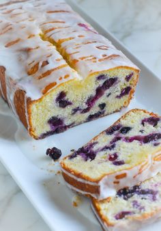 a loaf of lemon blueberry bread on a white plate