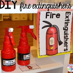 two fire extinguishers sitting on a table next to a sign that reads diy fire extinguishers