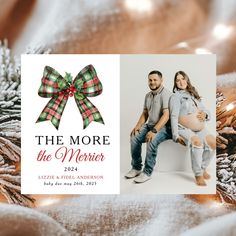 a christmas card with an image of a pregnant couple on it and the words, the more the merier