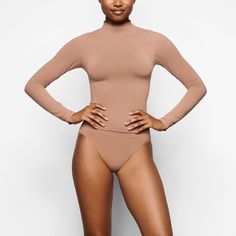 Soft Smoothing Turtleneck Top - Sienna | SKIMS Sleek Turtleneck Second-skin Bodysuit, Sleek Second-skin Turtleneck Bodysuit, Sleek High Neck Turtleneck, Sleek Solid Color High Neck Turtleneck, Second-skin Turtleneck Bodysuit With Thumbholes, Solid High Neck Turtleneck With Minimal Stretch, Fall Turtleneck Second-skin Bodysuit, Solid High Neck Turtleneck Minimal Stretch, Sleek Stretch Solid Turtleneck