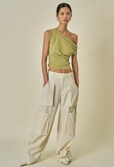 Sizes xs/s and m  color: cream  oversized fit  bellows pockets  two front pockets  two side pockets  two back pockets  100% nylon  dry clean  by the nkc store    product measurements:  xs/s  waist: 76.2cm / 30in  inseam: 78.74cm / 31in  m  waist: 88.55cm / 32.5in  inseam: cm / 3281.28in Streetwear Designs, Dallas Fashion, Bell Bottom Pants, Trouser Pants Women, Cargo Pant, Faux Leather Pants, Bell Bottom, Fall 2024, Pre Fall