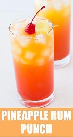 two glasses filled with drinks and topped with cherries