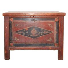 an old wooden chest with painted designs on it