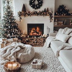 a living room with a christmas tree, fireplace and presents in front of the fire place