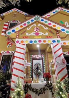 a house decorated for christmas with candy canes and decorations