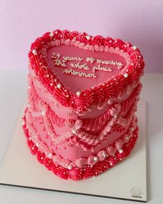 a heart - shaped cake with the words 25 years of marriage are made in hearts