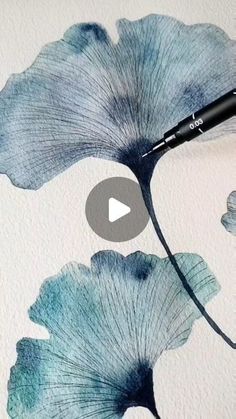 a painting with blue flowers on it and a black marker in the middle that says watercolor