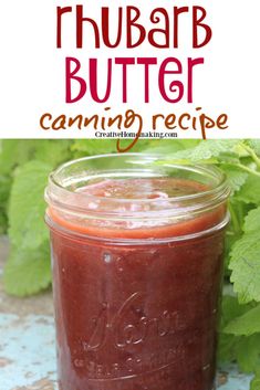 a jar filled with homemade rhubarb butter sitting on top of a table