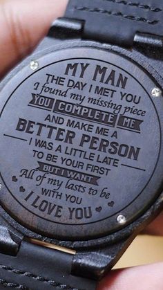 a wooden watch with an engraved message on the dial reads, my man i love you